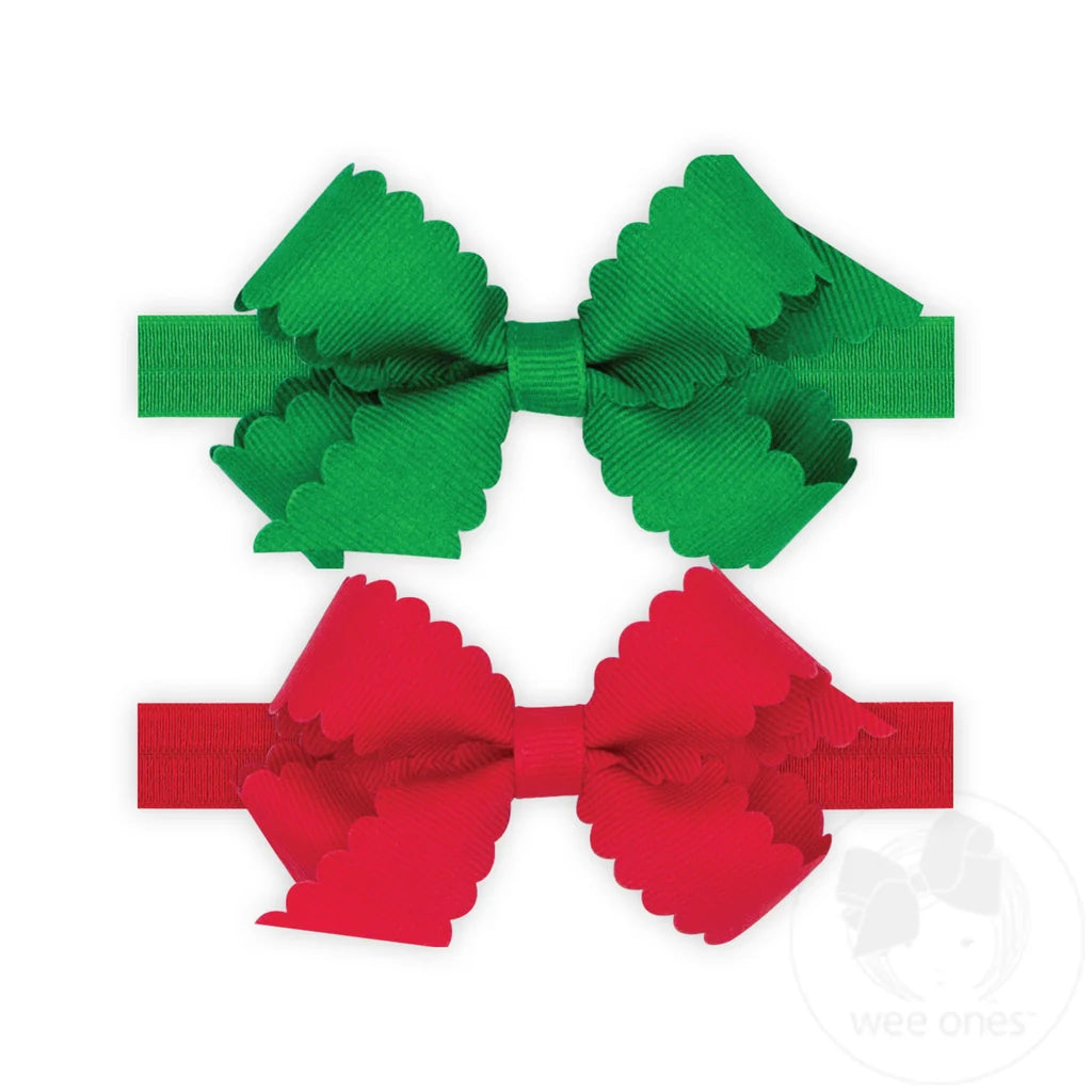 Two ribbon bow headbands, one green and one red, with scalloped edges, displayed on a white background.