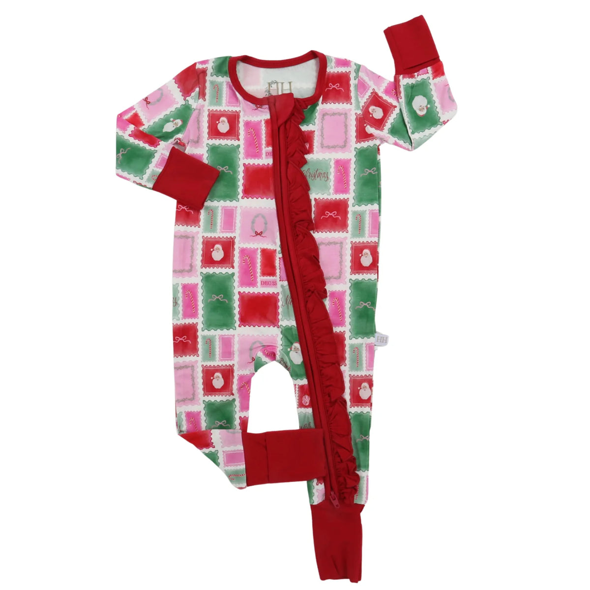 A baby footed sleeper with long sleeves and attached legs, featuring a festive red, pink, and green patchwork pattern with a ruffled front zipper closure. | Girls Ruffle Letter to Santa Zipper Romper by Hamner Hill
