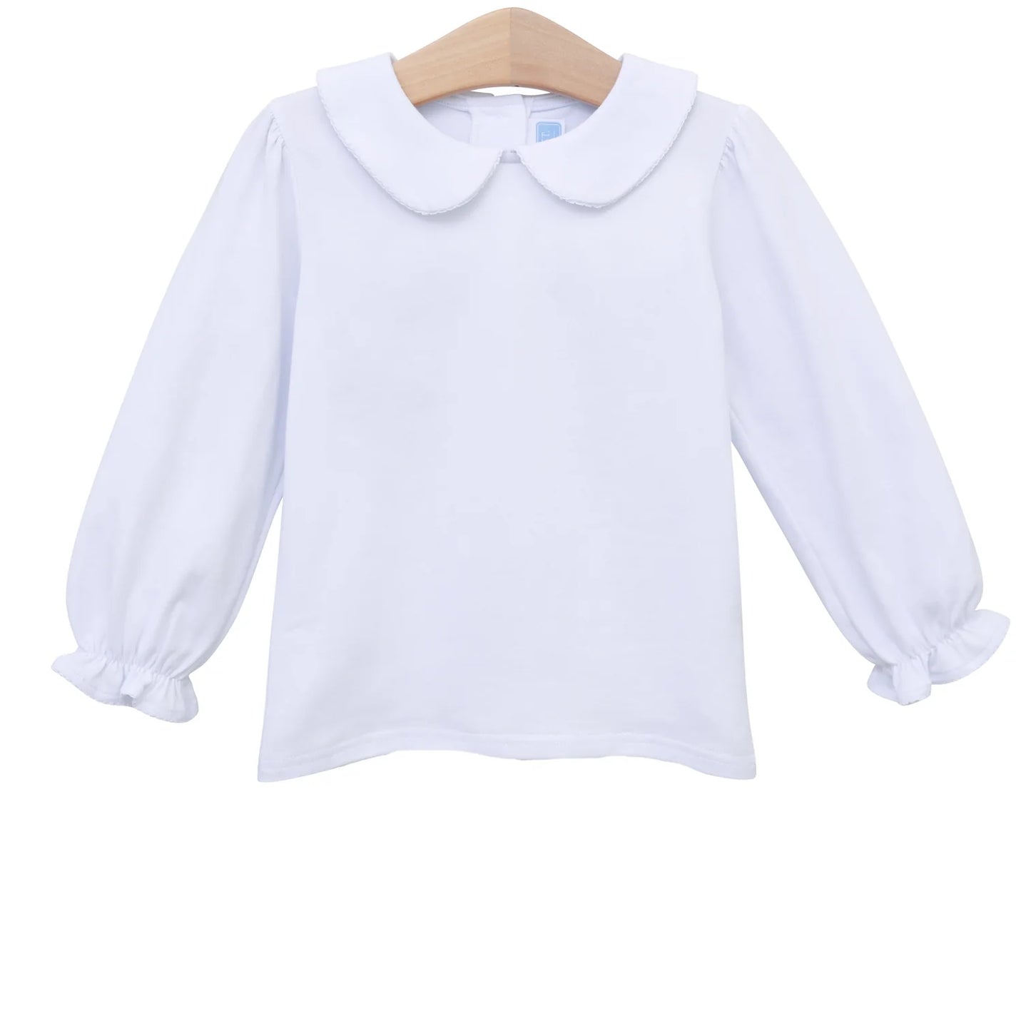 A white long-sleeve blouse with a Peter Pan collar and ruffled cuffs, hanging on a wooden hanger against a plain white background.