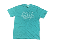 A turquoise crewneck t-shirt with a white graphic print on the chest featuring the word 'saplings' surrounded by small drawings of fruit and leaves, displayed flat against a white background.