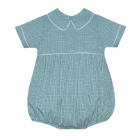 A baby romper in hunter green and white gingham pattern, featuring a Peter Pan collar, short sleeves with white piping, and a smocked waist seam.