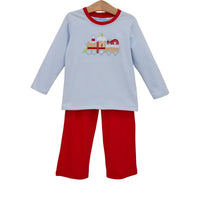 A two-piece children's pant set hanging on a wooden hanger against a white background. The set includes a long-sleeve top with light blue and white horizontal stripes, a red crew neck, and a cartoon train graphic on the chest, paired with solid red pants.