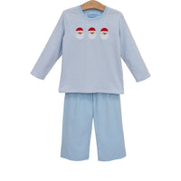 A two-piece children's pant set on a wooden hanger, featuring a light blue and white striped long-sleeve top with three embroidered Santa Claus faces, paired with matching light blue shorts.